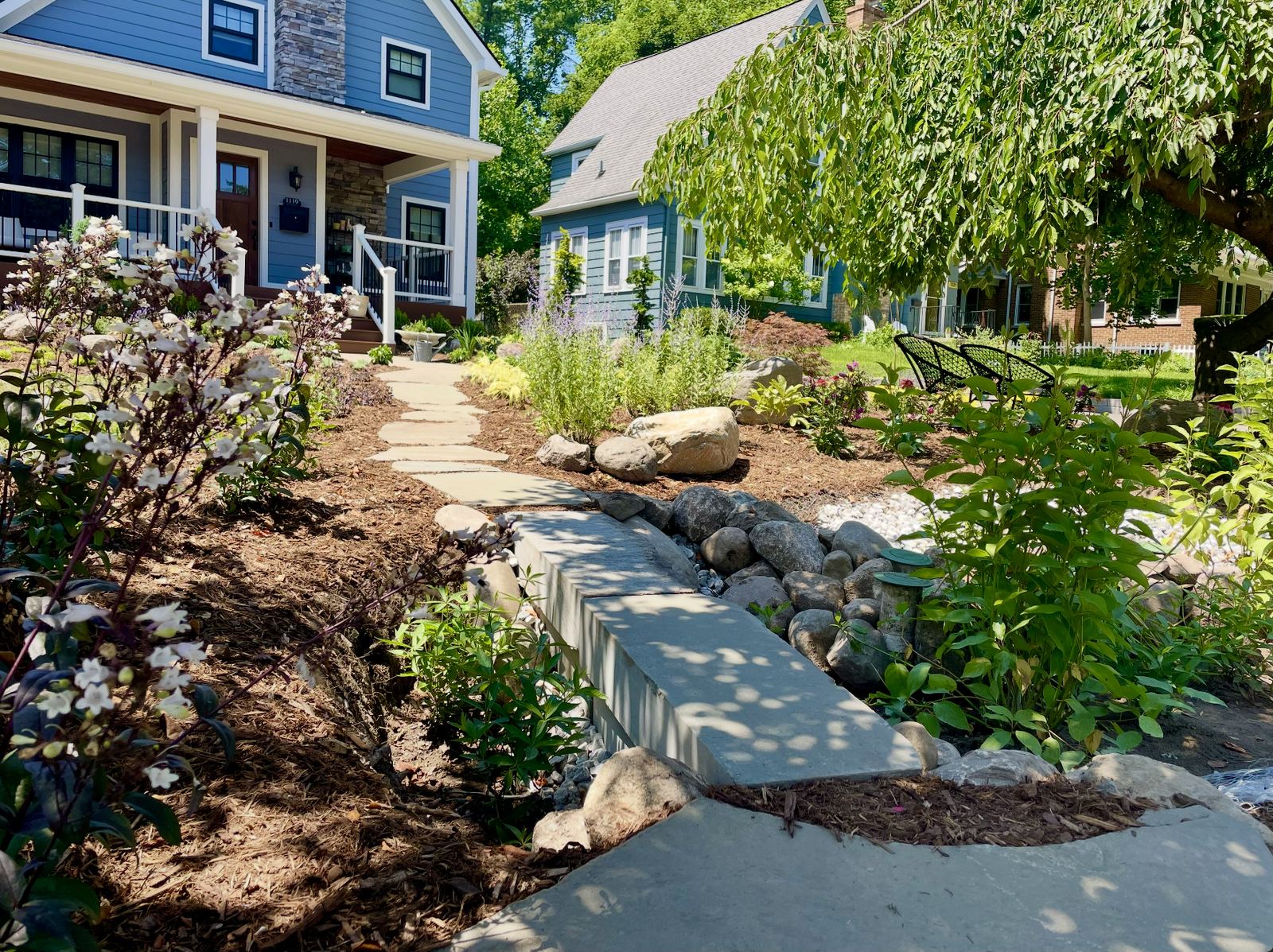 Flagstone stepping-stone path with a cobble-lined dry creek leading to the front porch, Ann Arbor