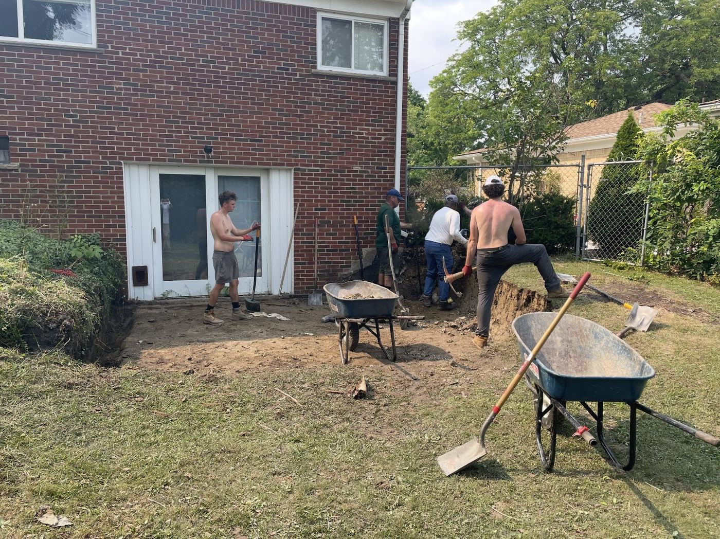 The crew excavating for a new retaining wall footing