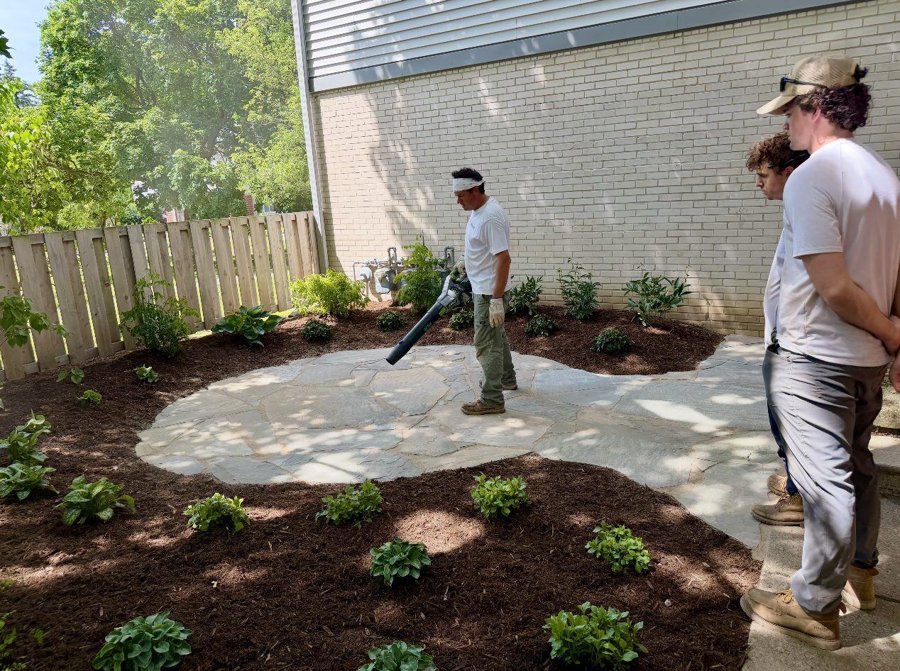 Finishing touches on a new flagstone patio and fresh plantings
