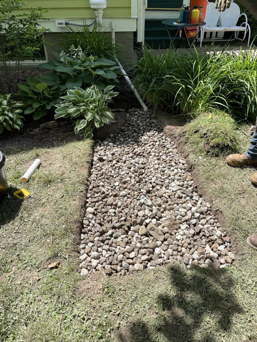 French drain channel along walkway