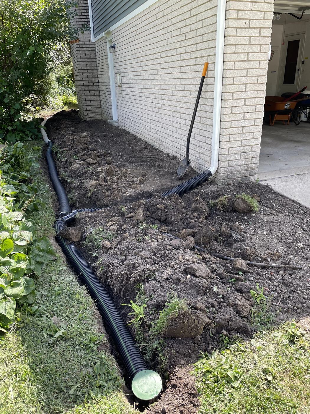 River rock drain channel along front walkway