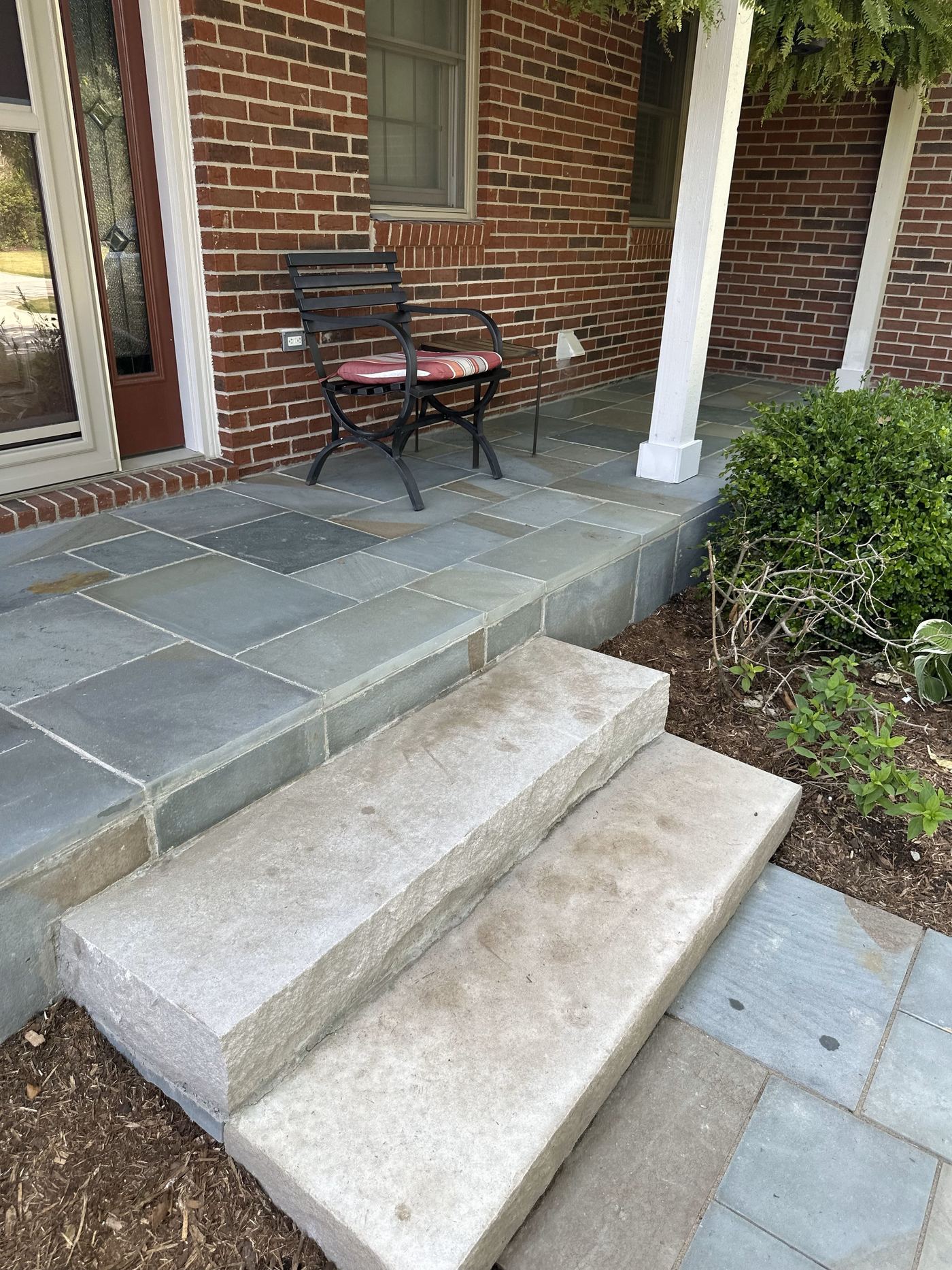 Flagstone porch with seating, finished