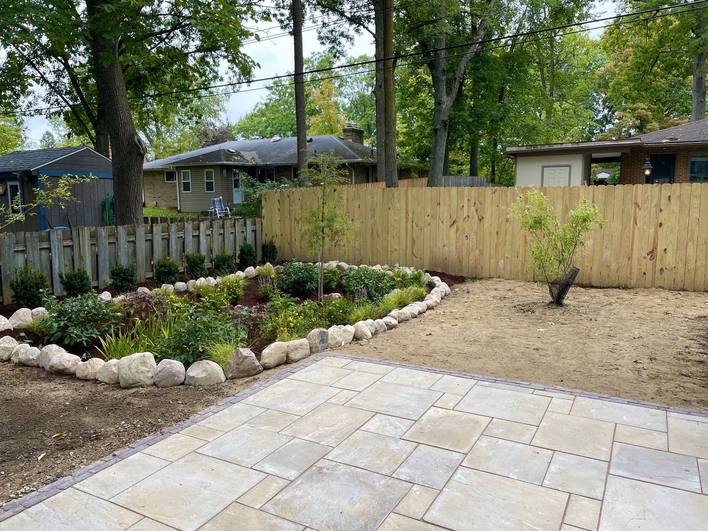 Rain garden integrated with paver patio